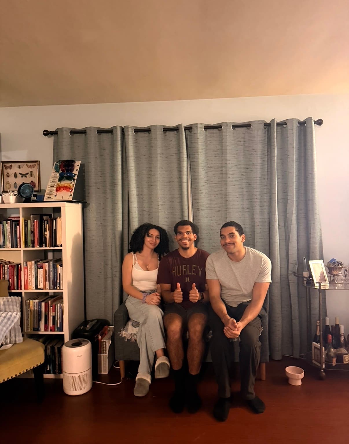 Autistic adult and supportive roommate at home in California